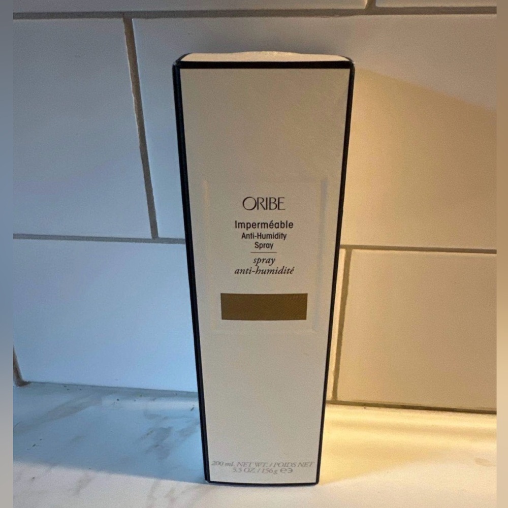 Oribe Impermeable Spray in Black and White